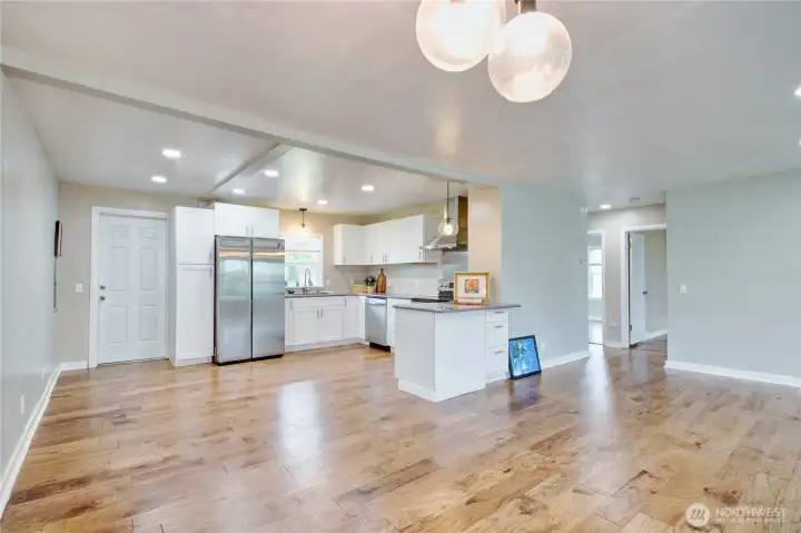 Looking from dining room to kitchen.  Door to backyard on the left.
