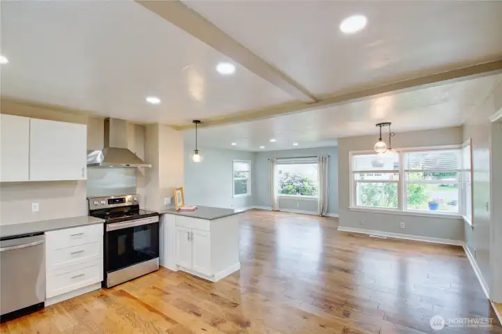Kitchen looking towards dining room and living room.  Lots of windows and natural light.