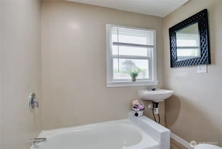 Primary bathroom with tub.