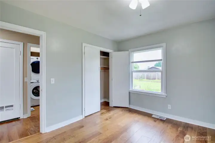3rd bedroom with nice closet space looking towards hall and main bathroom.