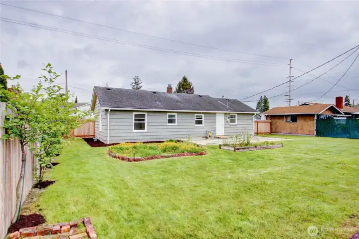 Backyard looking towards house and patio, fenced back yard.