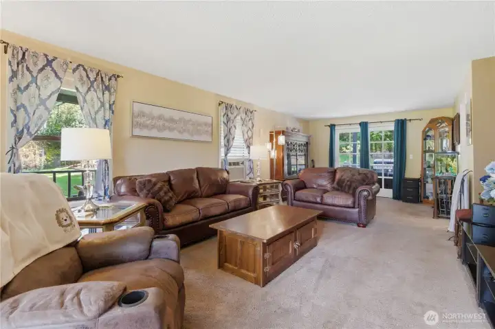 Formal living room with glass doors leading to an incredible outdoor living space. Formal living room with glass doors leading to an incredible outdoor living space.