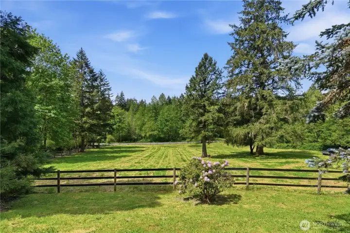 Fully fenced pasture is a picture perfect view from the front porch of this home. Fully fenced pasture is a picture perfect view from the front porch of this home.