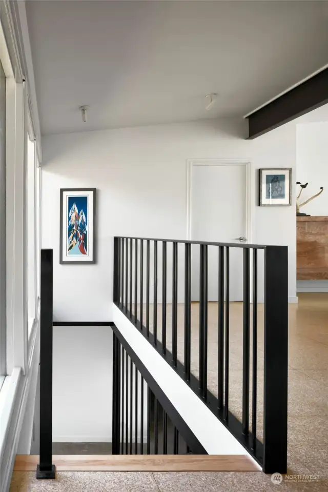 Artistic floating stairs with metal railings. Photo Source: Babienko Architects and Morris Moreno
