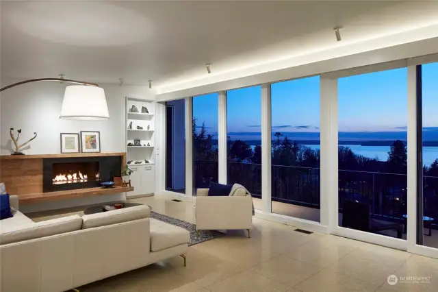 Overlooking Evening layers of blue hues over the Sound from the living room. Photo Source: Babienko Architects and Morris Moreno