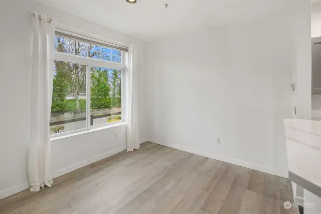 Large window in dining area providing natural light.