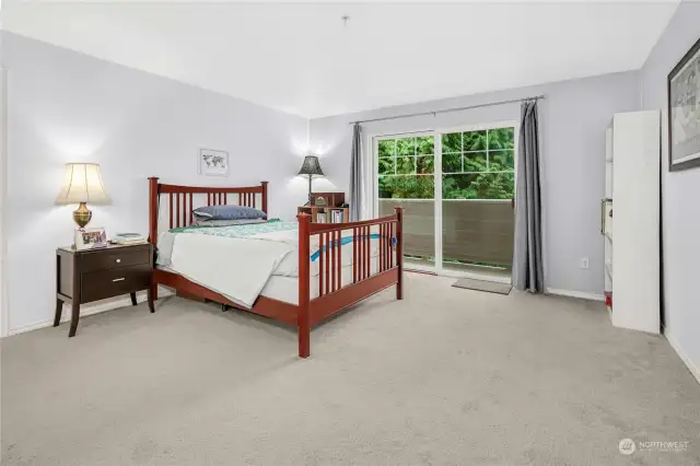 Primary bedroom with balcony.