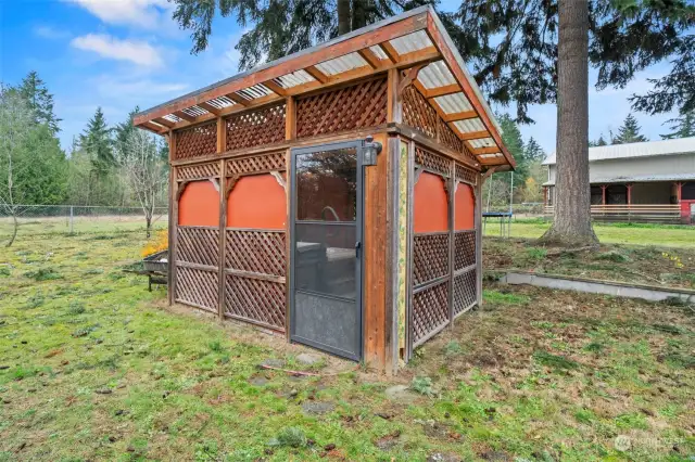 Exterior view of the hot tub area, enclosed in the fully fenced cyclone backyard for added privacy.