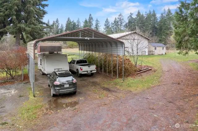 Need extra space for your toys? This spacious carport has you covered!