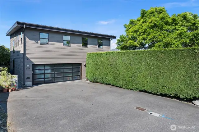 Street side of the home - plenty of parking in a spacious 2-car garage and car park.