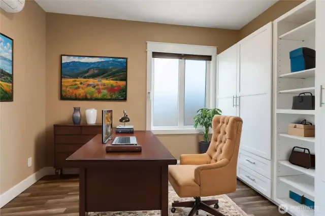 Second bedroom virtually staged as an office.