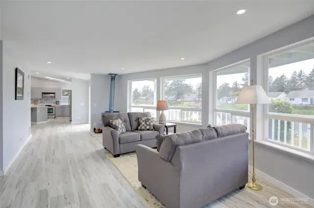 Living room with an abundance of windows and natural lighting. View of the water.