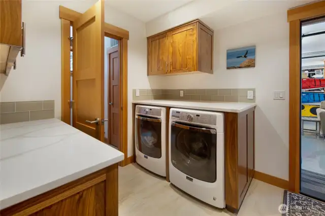 The utility room off the garage has plenty of counter space.