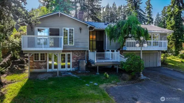 Not your ordinary split-level. The back of the house has accessible ramp entry to main level living.