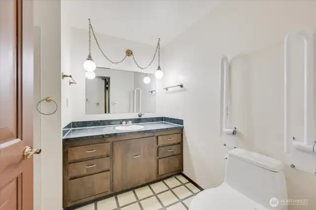 Main bath with wide door and grab bars