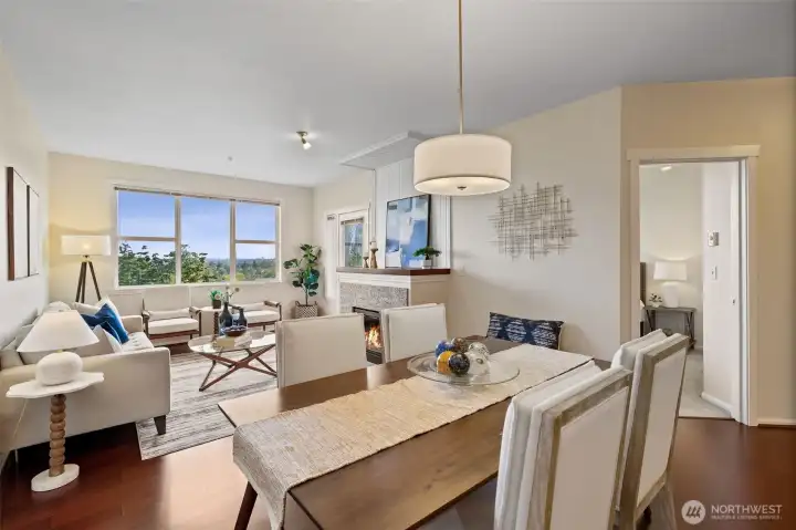 Remarkable contemporary northwest-facing condo offers an open floor plan with lovely territorial and downtown skyline views! The dining room and cozy living room with a faux fireplace and direct access to an outdoor deck enhance the living experience