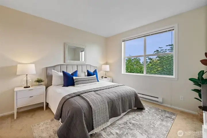 Primary suite comfortably fits a king-sized bed, an en-suite bath, and a walk-in closet.