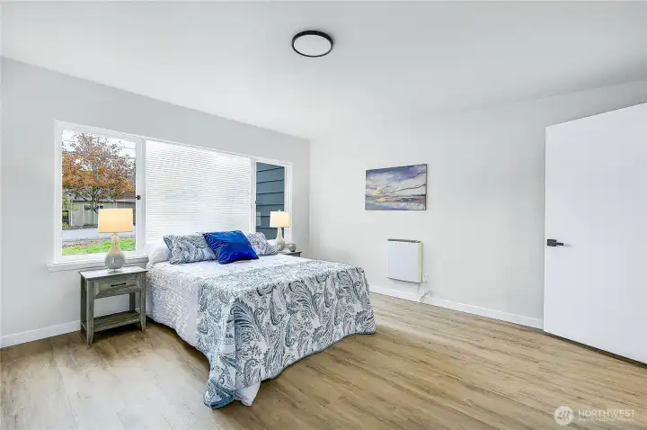 The primary suite is spacious with lots of natural light.