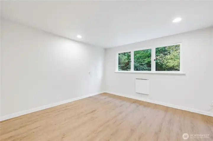 Bedroom #3 un-staged, it also enjoys a peaceful wooded setting views.
