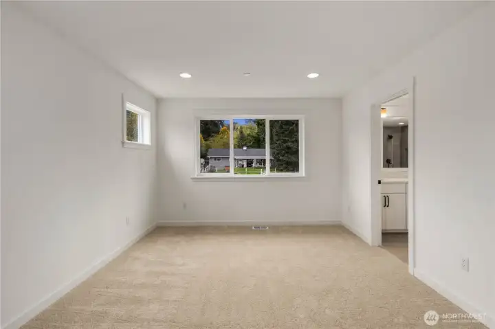 Primary Suite:  Soft natural light fills the primary suite from both a wide rear-facing window and a higher side window that adds privacy while maintaining brightness. The room’s generous proportions comfortably accommodate multiple furniture layouts and create a calm, open retreat at the end of the day. Set within Bothell’s well-connected Canyon Park area, the suite benefits from nearby parks, easy commuter access, and a quiet residential setting that enhances everyday Northwest living. An attached sitting room extends the suite’s livability, offering a flexible place to unwind, read, or create a personalized corner of comfort.    These photos are from Lot 5 at Gooden Hollow, which is the same floorplan, but a different home than listed here. However, other homes in the community will have changes, so all photos, renderings, site maps, and floorplans are for visualization purposes only. Plans, colors, building orientation, finishes, home outlook, and other details can and WILL vary.