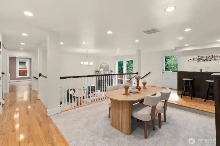 Dining room adjacent to the kitchen and deck for seamless indoor-outdoor gatherings