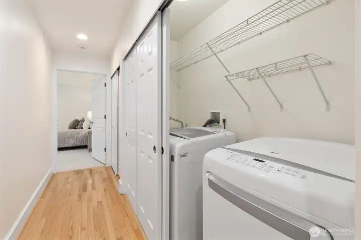 Thoughtful main-floor layout connecting living spaces, bedrooms, and outdoor access. Convenient utility room with space for storage and organization.