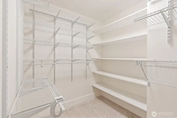 Primary bedroom walk-in closet