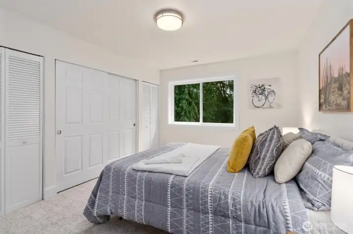 Another comfortable bedroom, perfect for guests or a nursery.