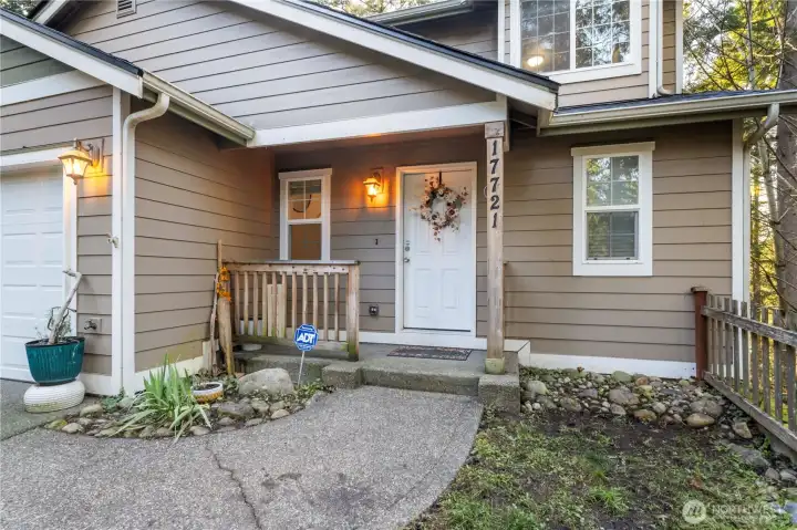 A welcoming covered porch greets your guests