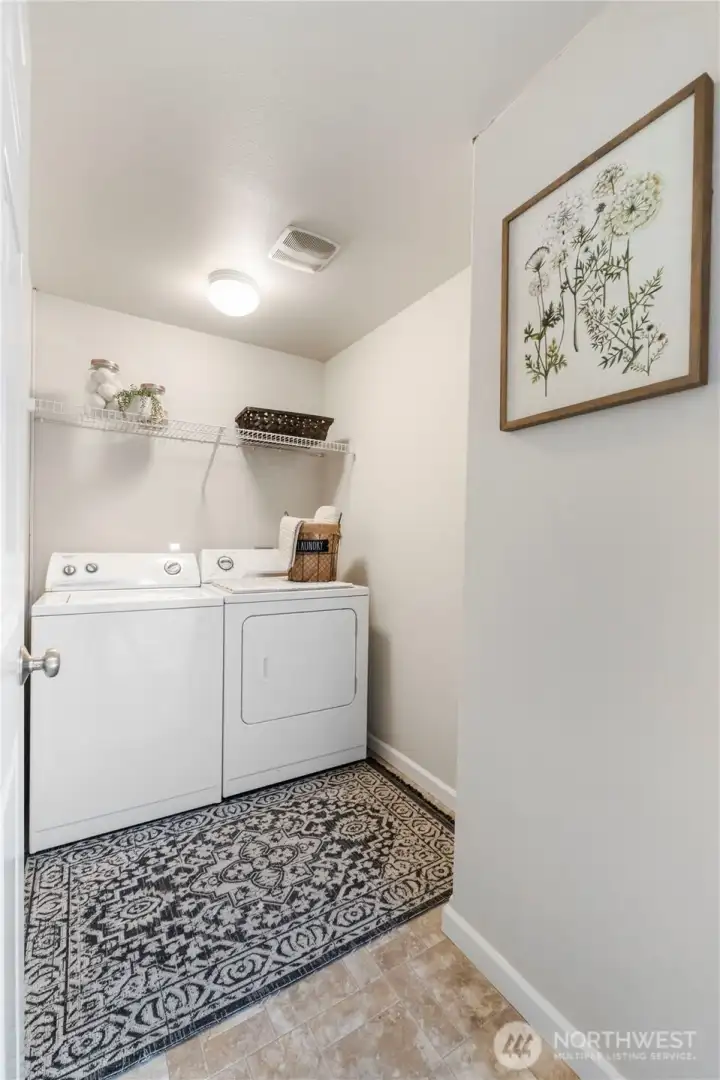 The handy upper level laundry has nice shelving and the washer & dryer are also included