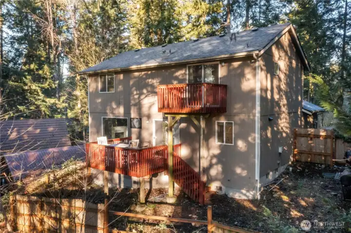 BBQ and enjoy the views from the kitchen deck with access to the fenced yard. Check out that brand new roof! The lower deck has a gate and the side fence also offers and access gate