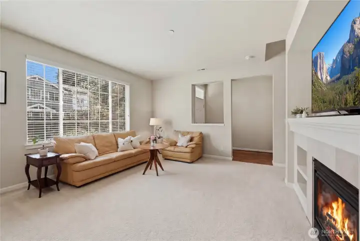 Expansive and open living area with lovely, picturesque window for natural light.