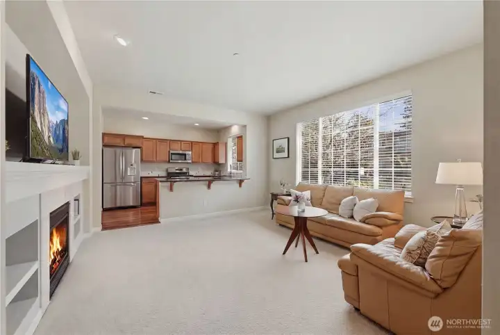 Open living area leads to the stunning kitchen with eating bar.