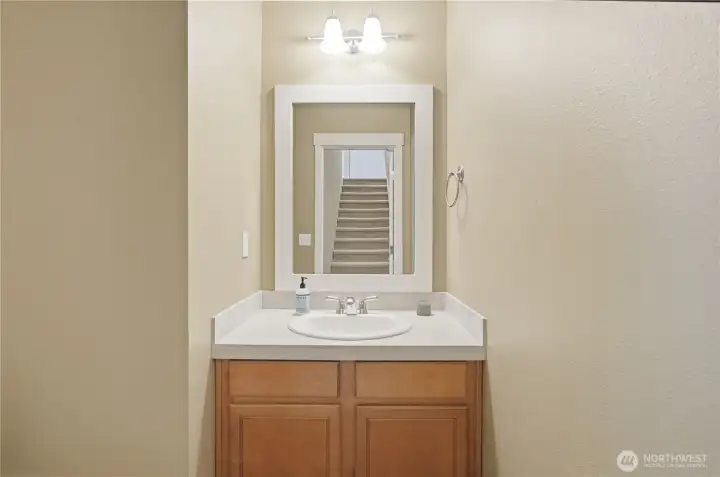 Powder room off formal entry.