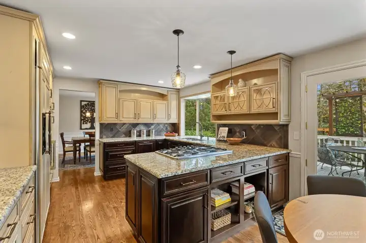 Under counter and buffet lighting as well as a wall of windows facing the backyard.