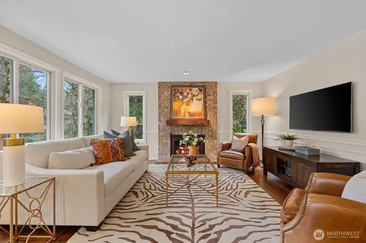 Family room is bright and offers one of 2 fireplaces