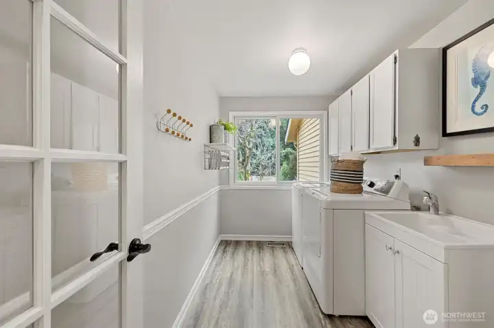 Main floor laundry room is bright with plenty of space