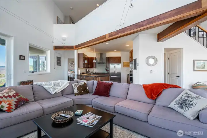 View 2 of Living Room with exposed wood beams.