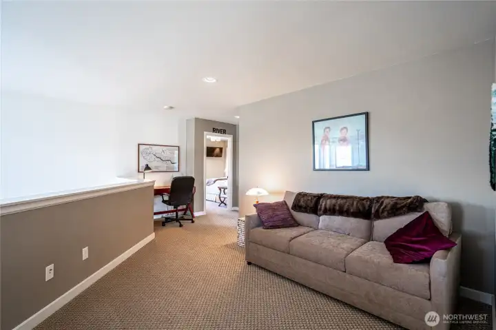 Upper level bonus/media landing with office.