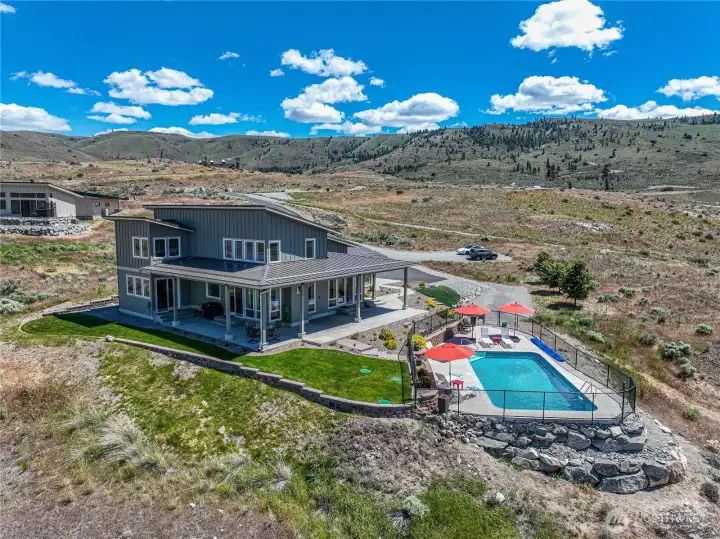 Aerial view of home and pool area.