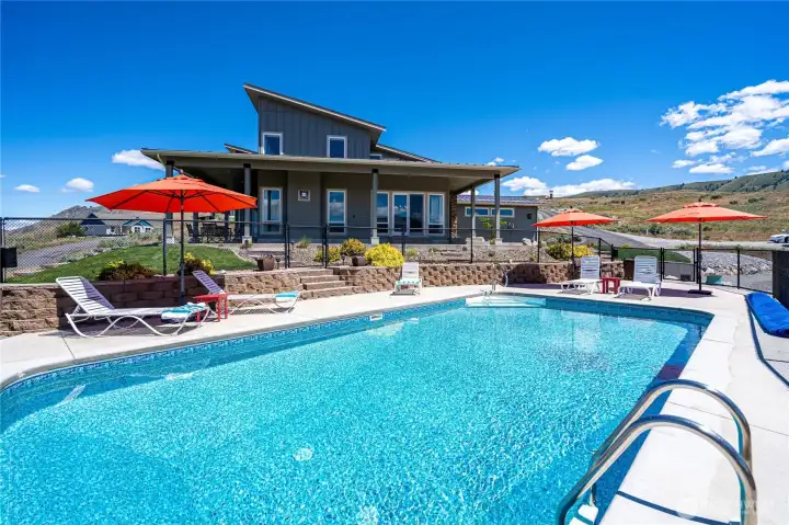 Pool, home and outdoor living area.