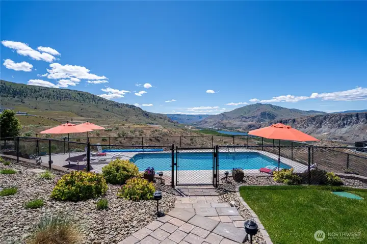 View of pool and outdoor living area overlooking the Columbia River.