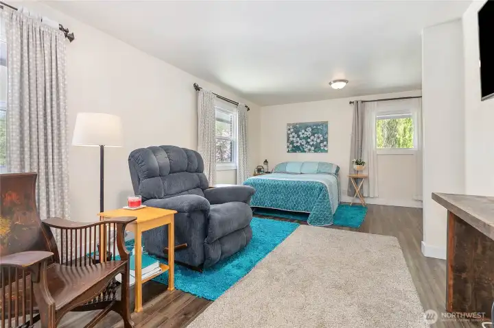 Large primary bedroom with ample space to introduce a mini kitchen and create a separate living space.
