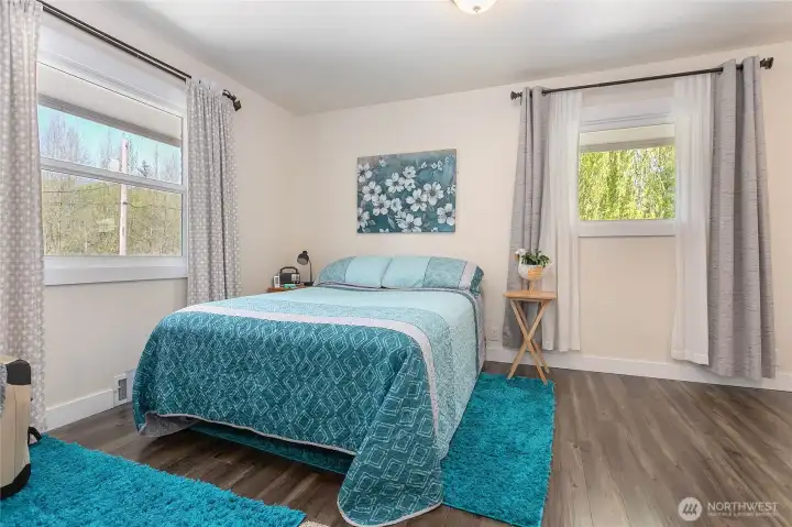 The primary bedroom sits above the garage space.