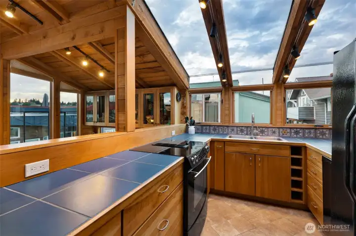 The kitchen is u-shaped and the skylights are stunning.