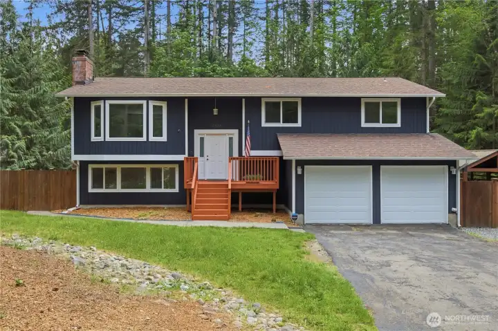 Beneath towering evergreens, this beautifully updated split-level home offers the perfect blend of privacy, comfort, and Northwest charm.