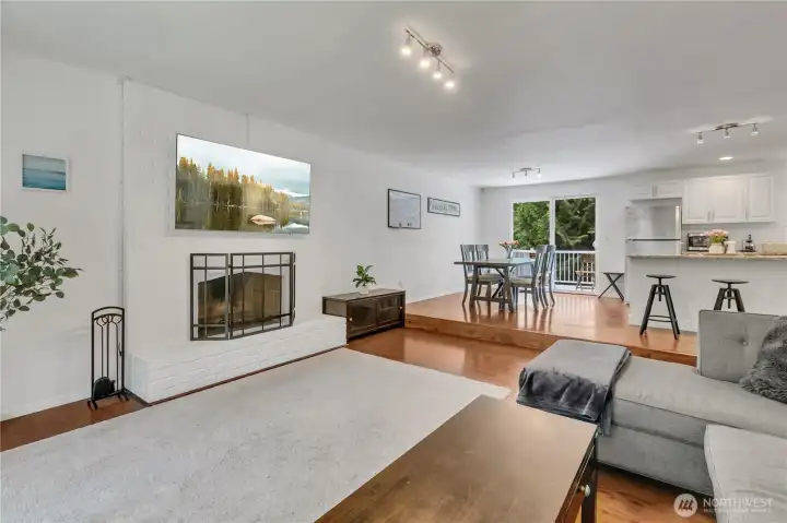 Gather in the bright and inviting living room, designed with open sightlines and a warm, welcoming atmosphere.