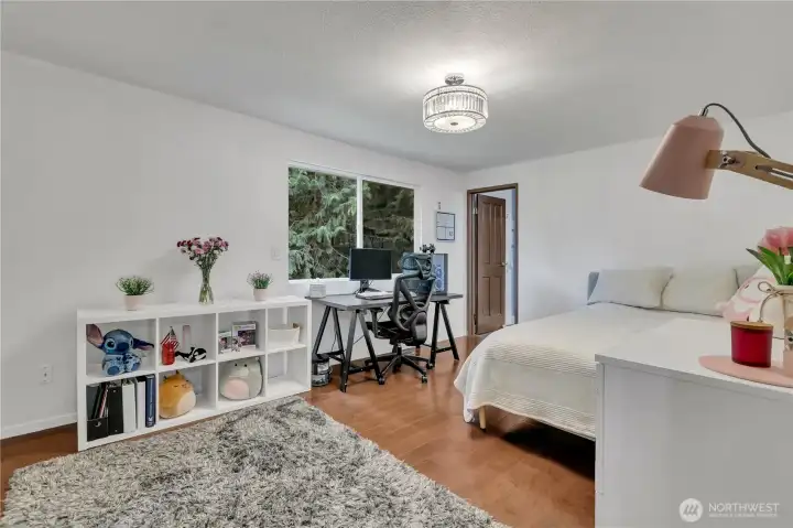 The large primary suite is complemented by a beautifully refreshed en suite bathroom with modern finishes.