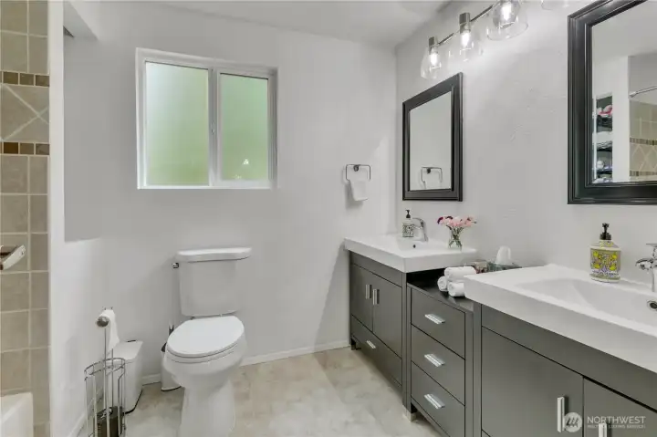 This thoughtfully updated bathroom features fresh finishes, modern fixtures, and timeless style.