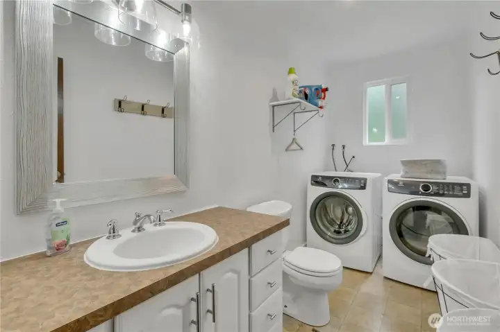 The combined bathroom and laundry area provides everyday convenience.